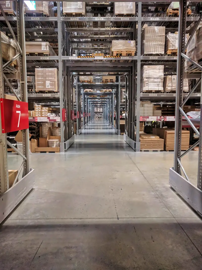 Warehouse aisles with shelves full of boxes.
